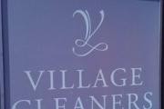 Village Cleaners logo